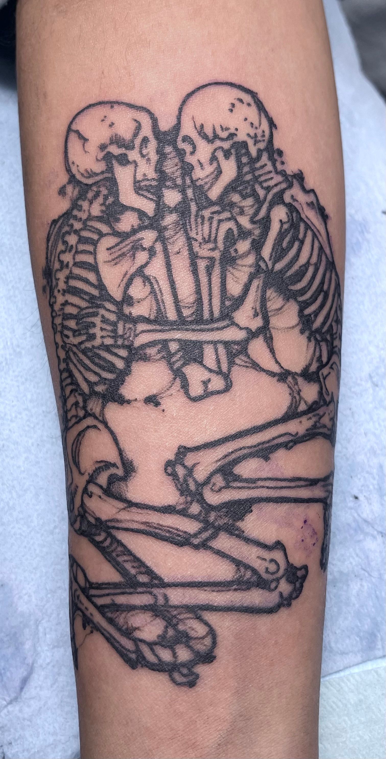 Embracing skeletons tattoo