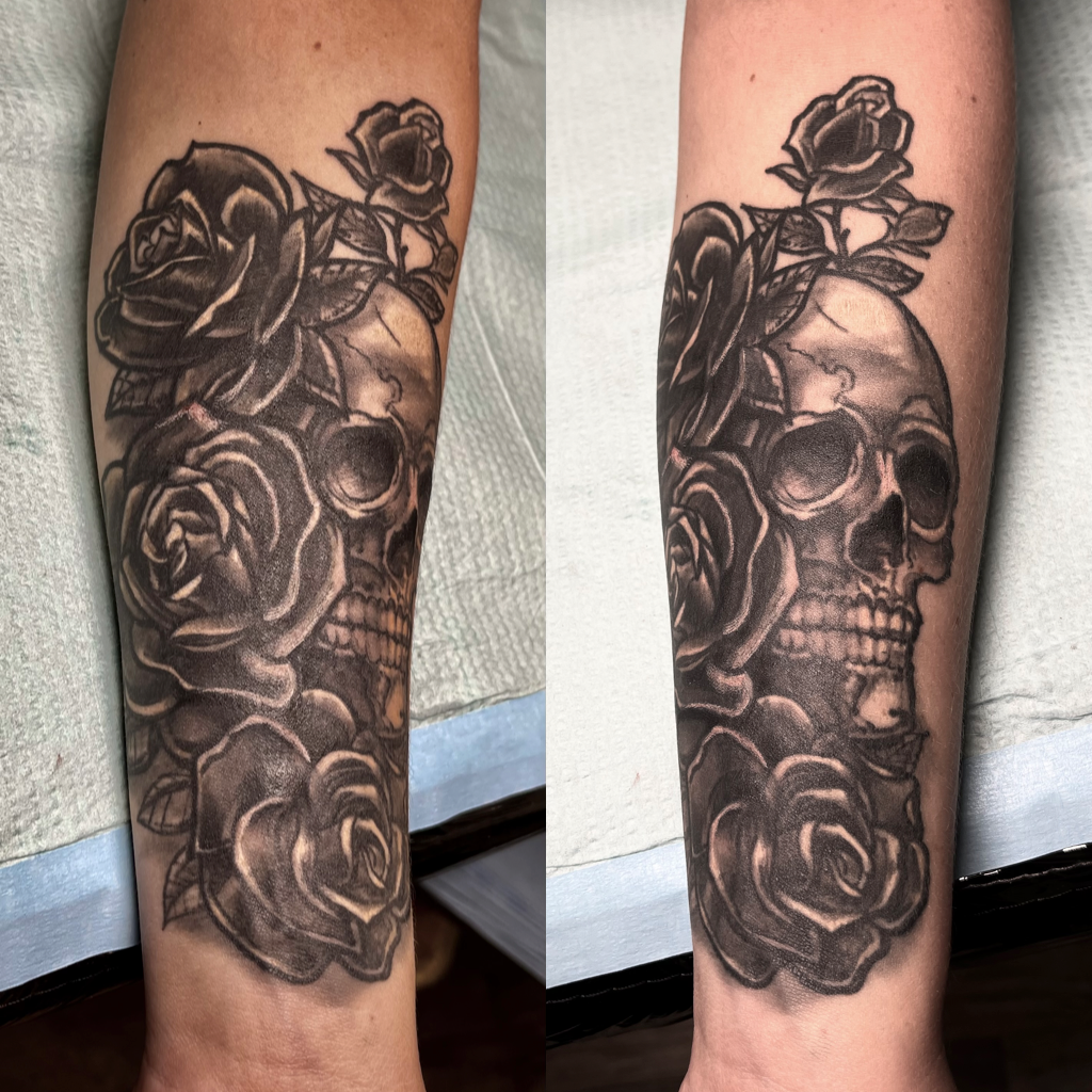 Skull with roses arm tattoo