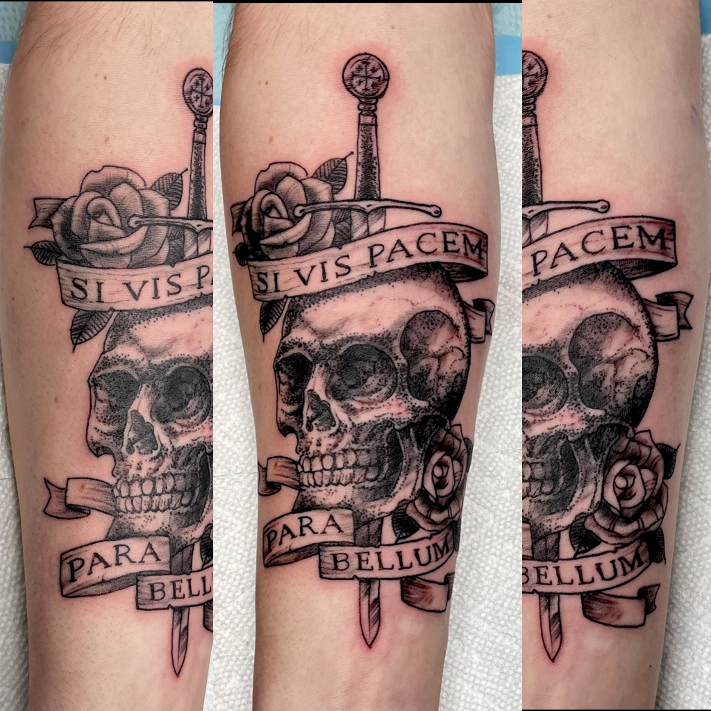 Skull with sword and banner tattoo