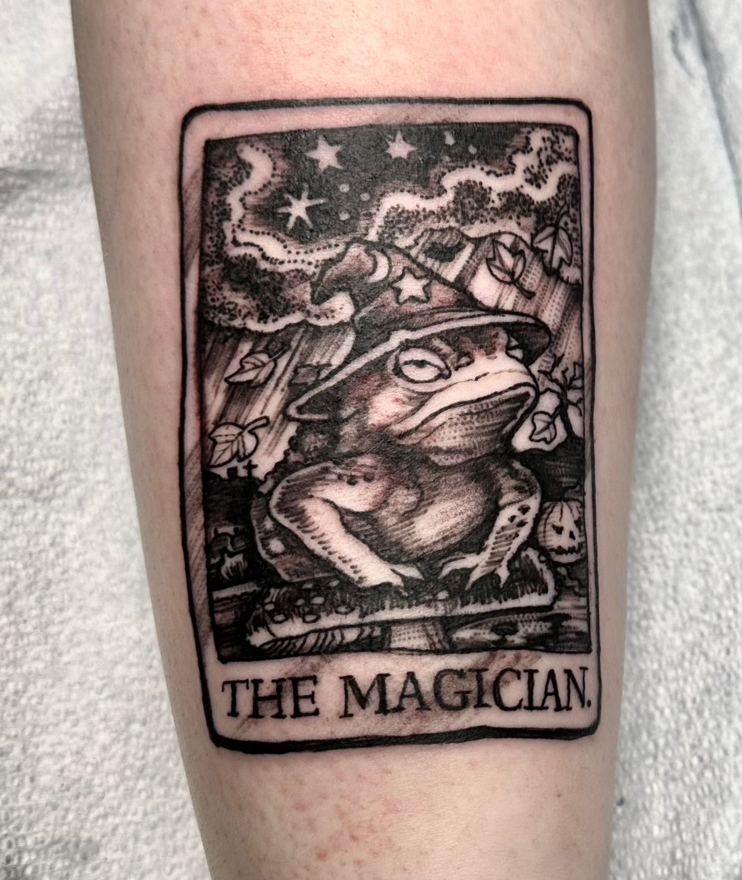 Tarot card with magic frog tattoo