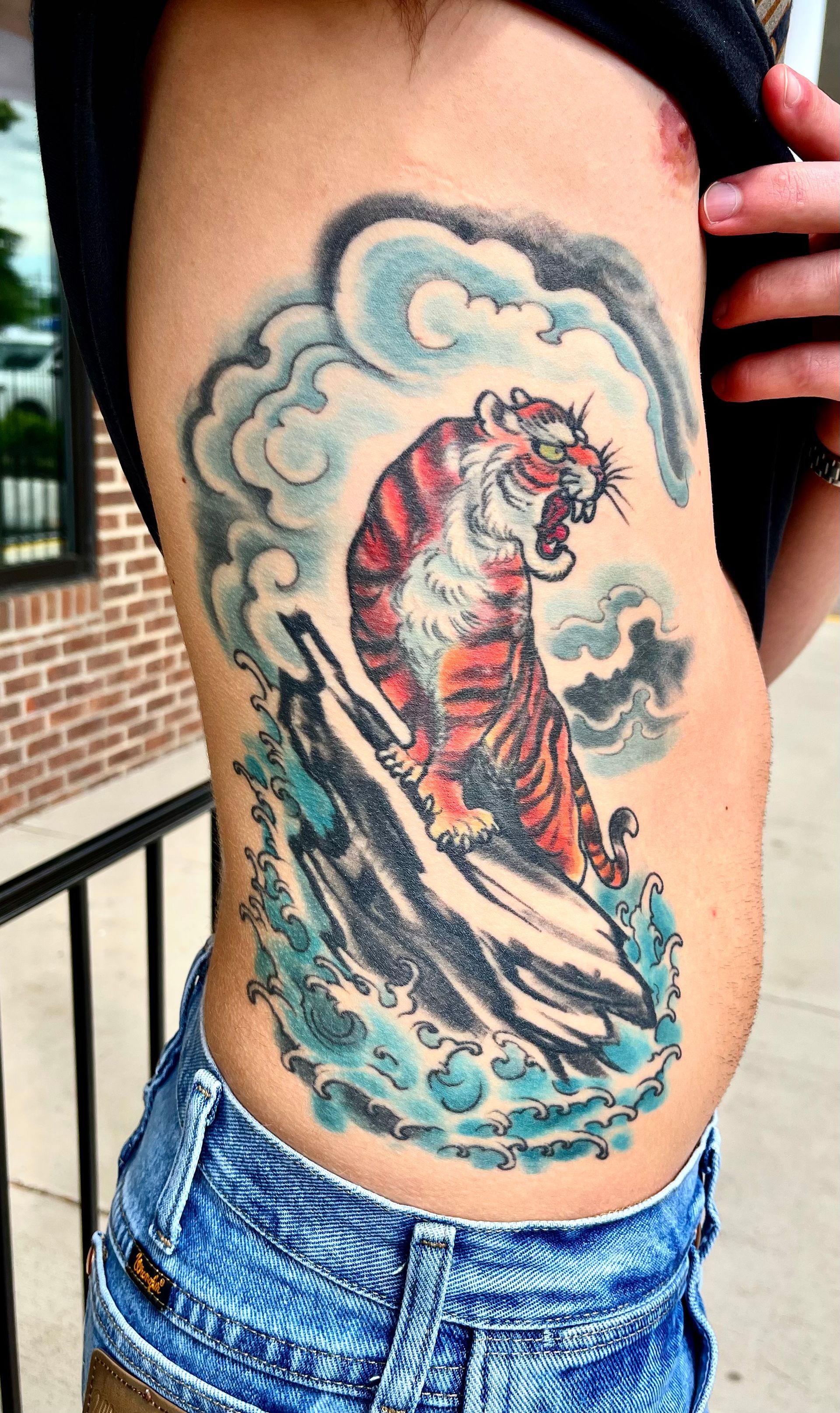 Tiger on rock large tattoo