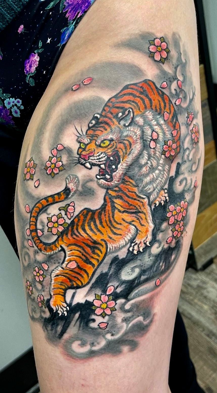 Tiger in cherry blossoms tattoo