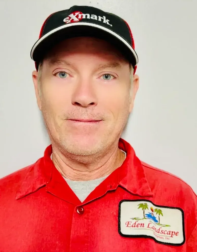 Man in red shirt and hat with 