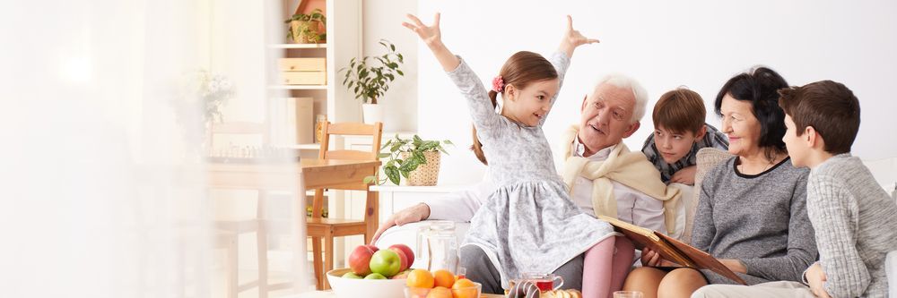 Family Looking at a Photo Album — Amanda Jade Photography In Mareeba, QLD
