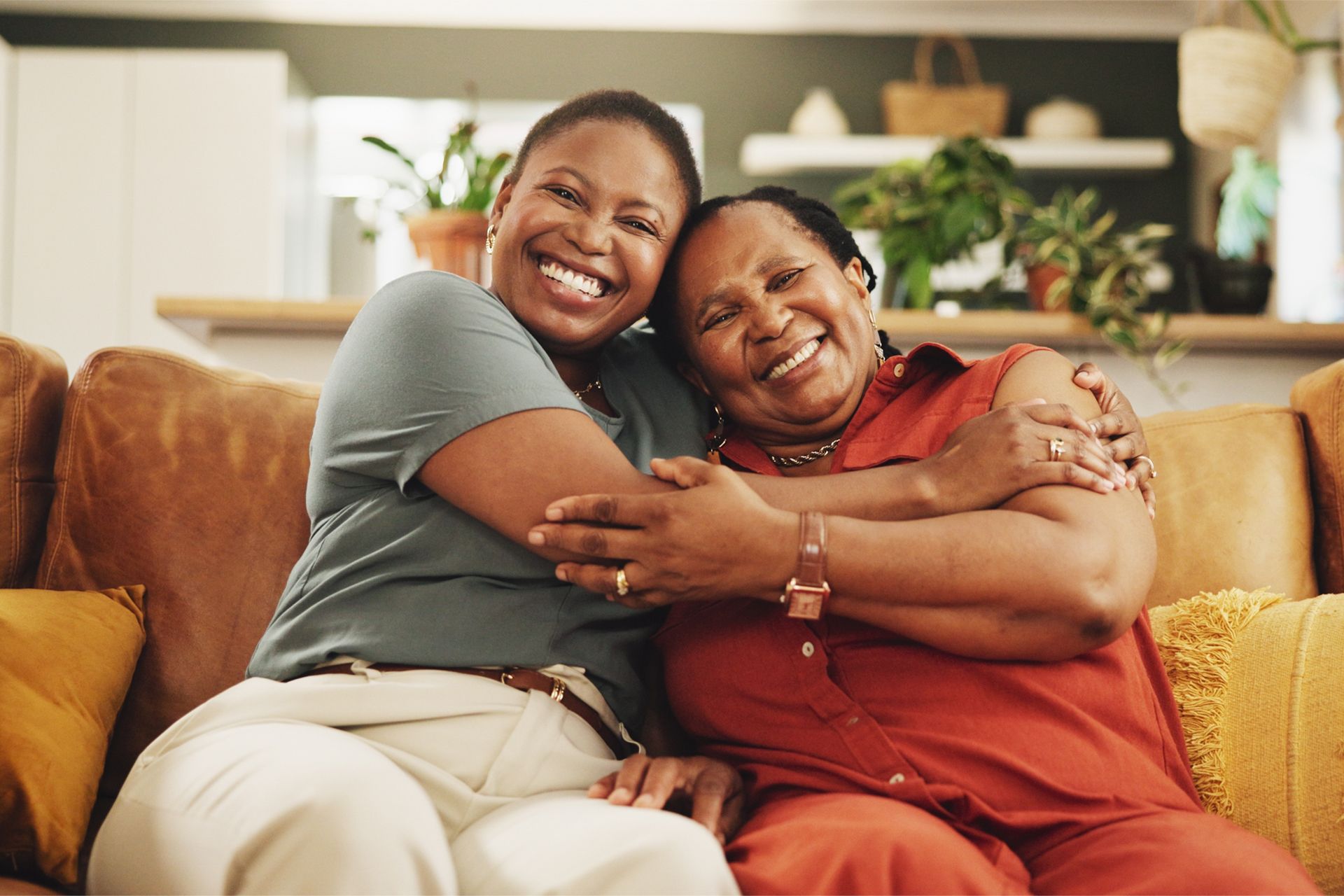 Happy daughter and mother hugging each other