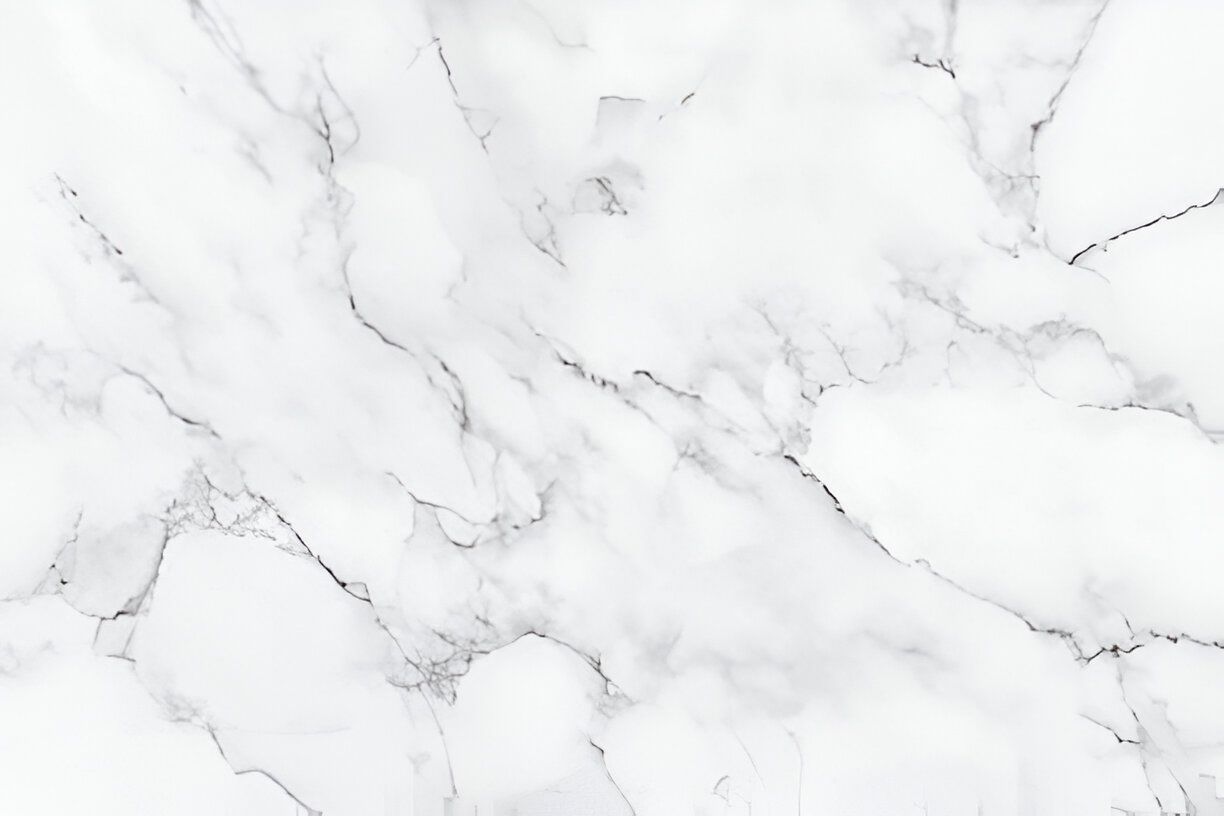 A close up of a white marble texture on a white background. A close up of a white marble texture on a white background.