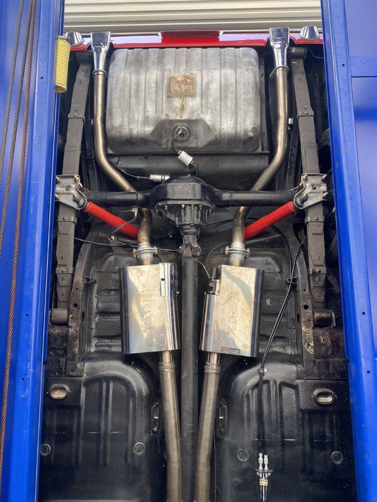The Underside of a Car is Shown With Exhaust Pipes — Savins Radiator Service In Lismore, NSW