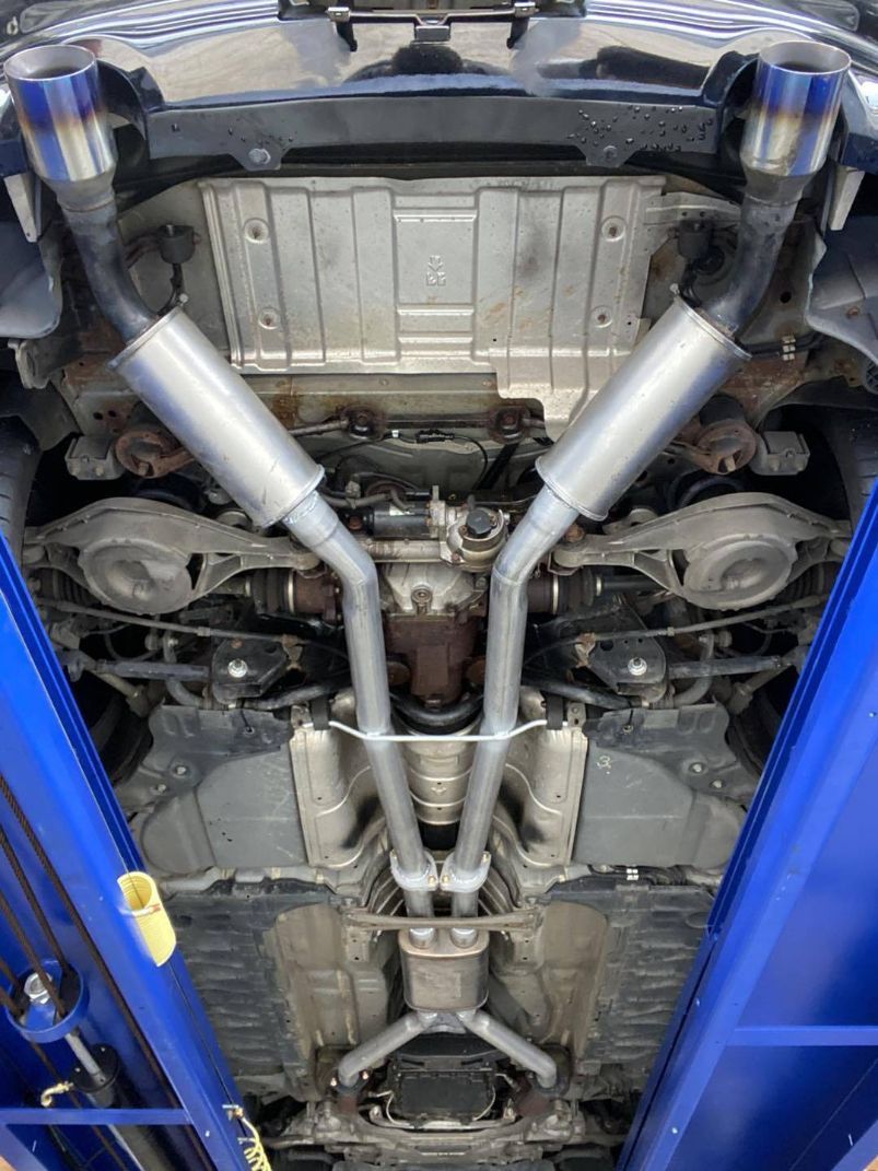 A Close Up of the Underside of a Car on a Lift — Savins Radiator Service In Lismore, NSW