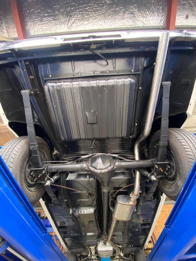 The Bottom of a Car is Shown on a Lift — Savins Radiator Service In Lismore, NSW