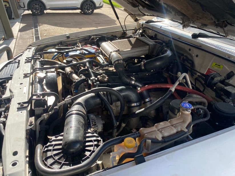 The Engine of a Car is Shown With the Hood Open — Savins Radiator Service In Lismore, NSW