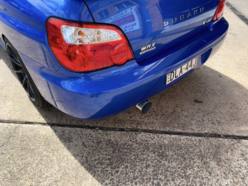 A Blue Subaru is Parked on the Side of the Road — Savins Radiator Service In Lismore, NSW