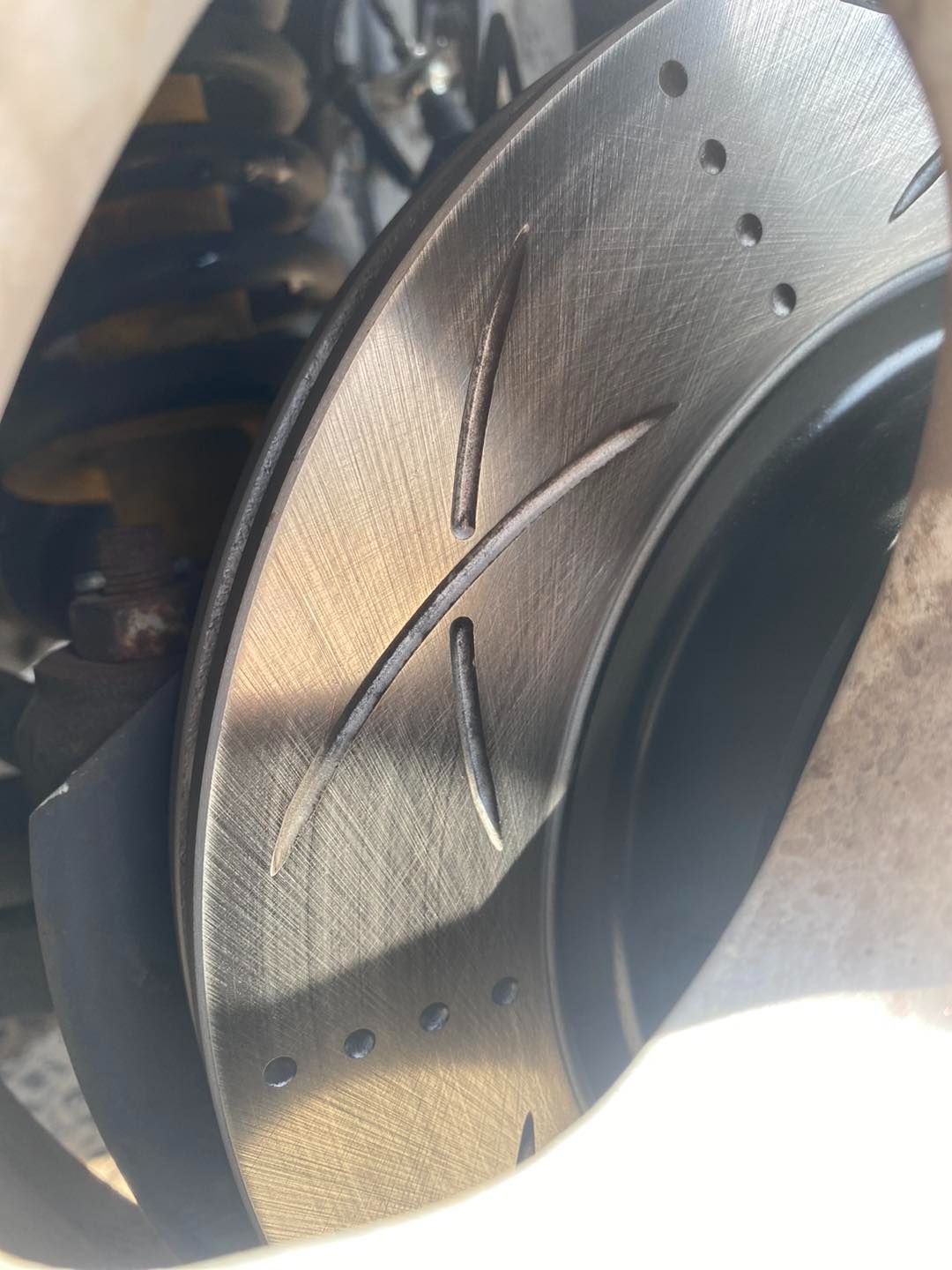 A Close Up of a Brake Disc on a Car — Savins Radiator Service In Lismore, NSW