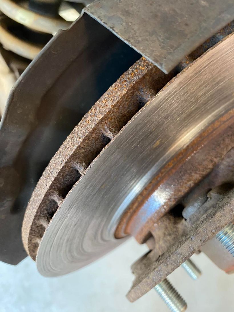 A Close Up of a Brake Disc on a Car — Savins Radiator Service In Lismore, NSW