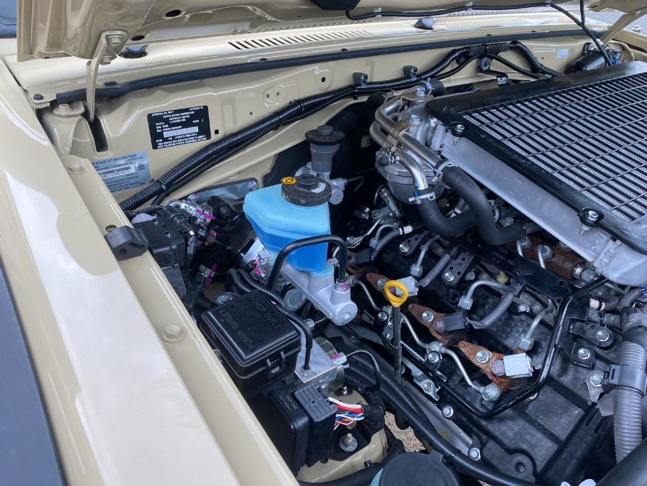 A Close Up of a Car Engine With the Hood Open — Savins Radiator Service In Lismore, NSW