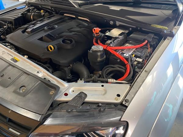 The Engine of a Silver Car With the Hood Open — Savins Radiator Service In Lismore, NSW