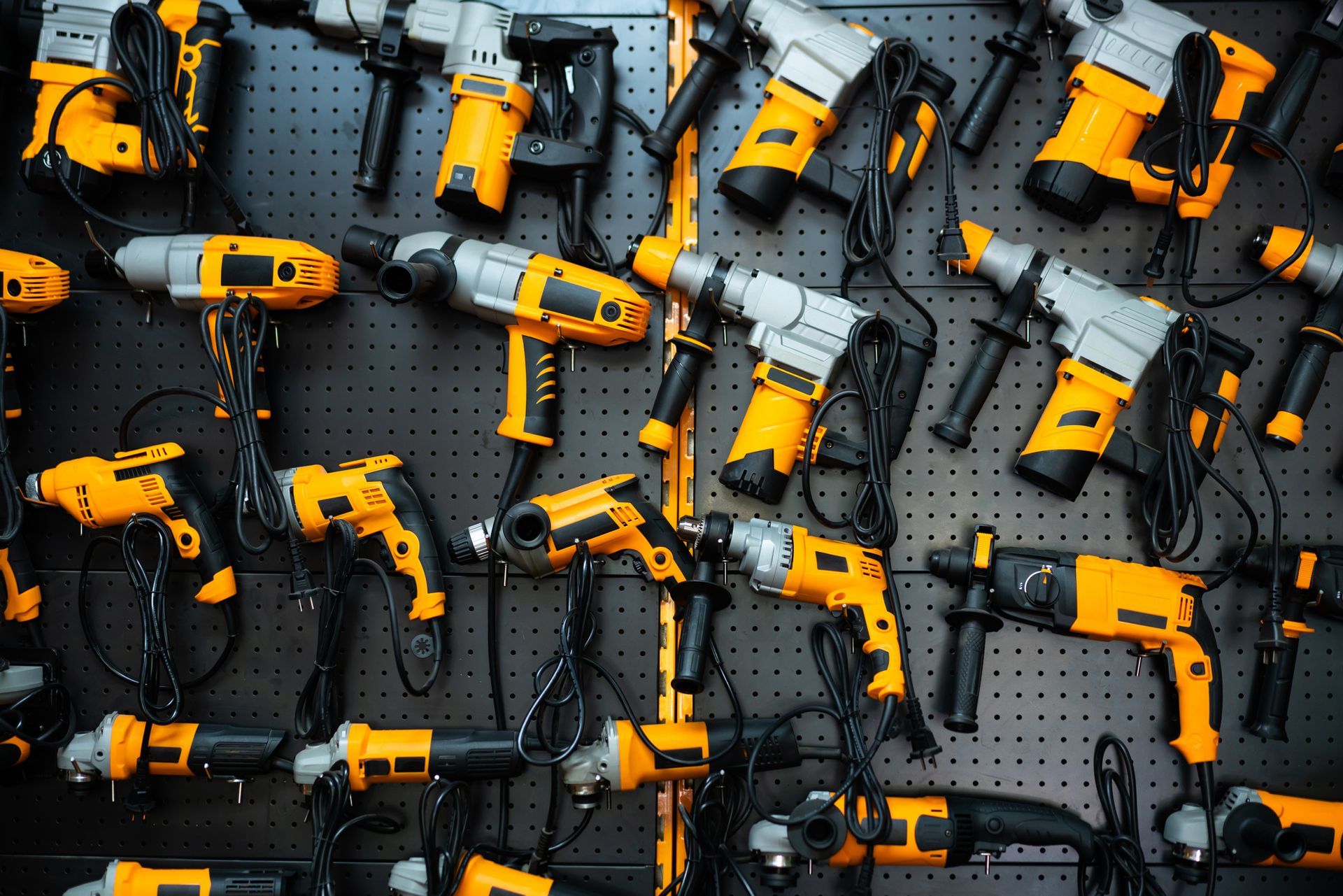 A wall showcasing an array of yellow and black power tools, highlighting power tools for sale.