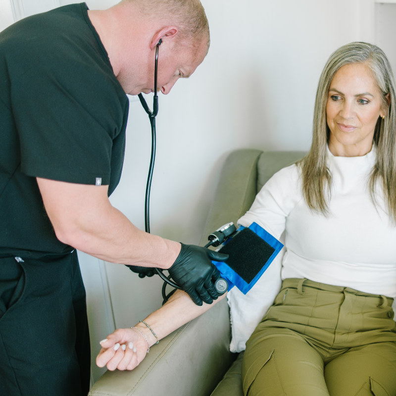 Woman on a chair receiving IV treatment