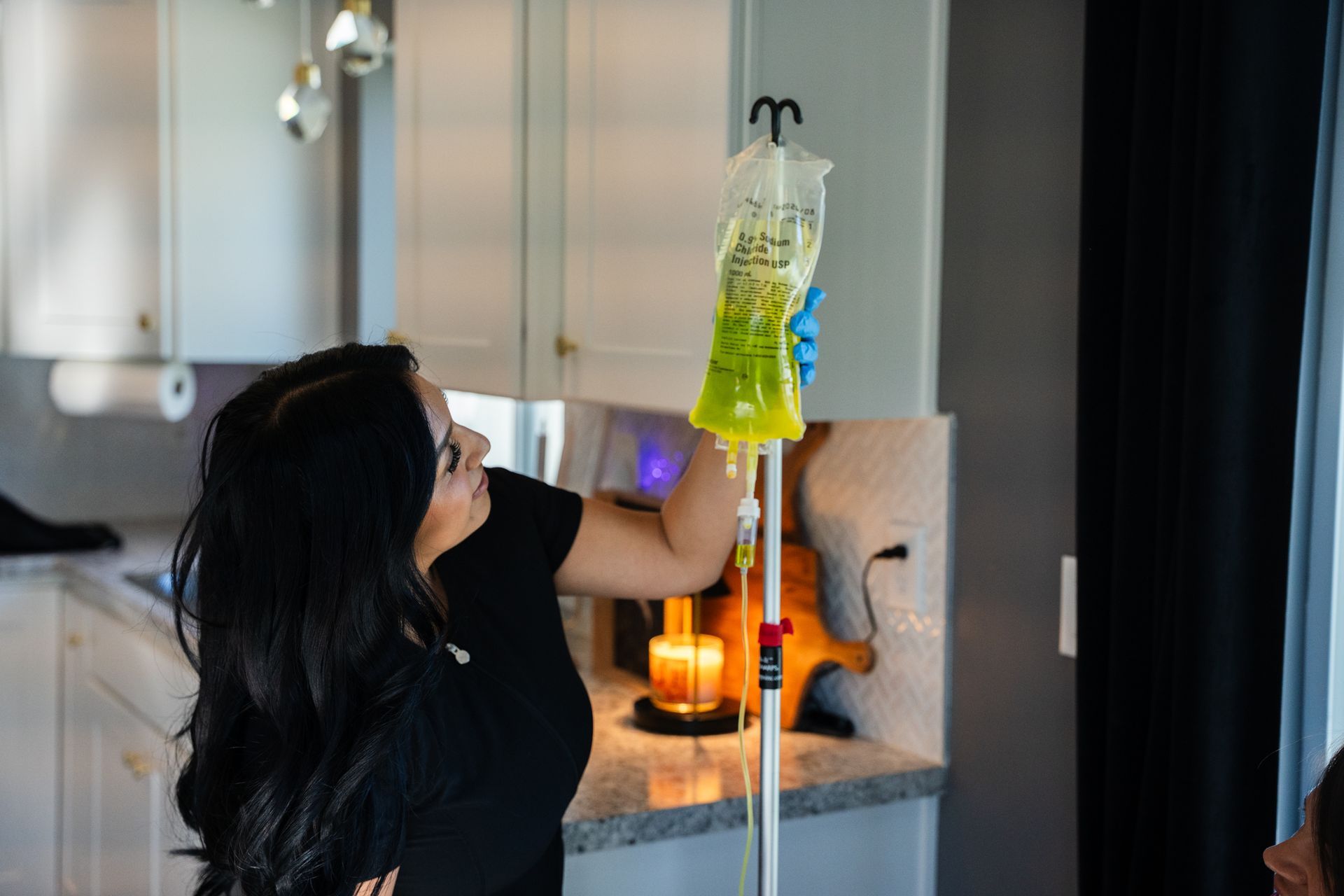 Woman on a chair receiving IV treatment 