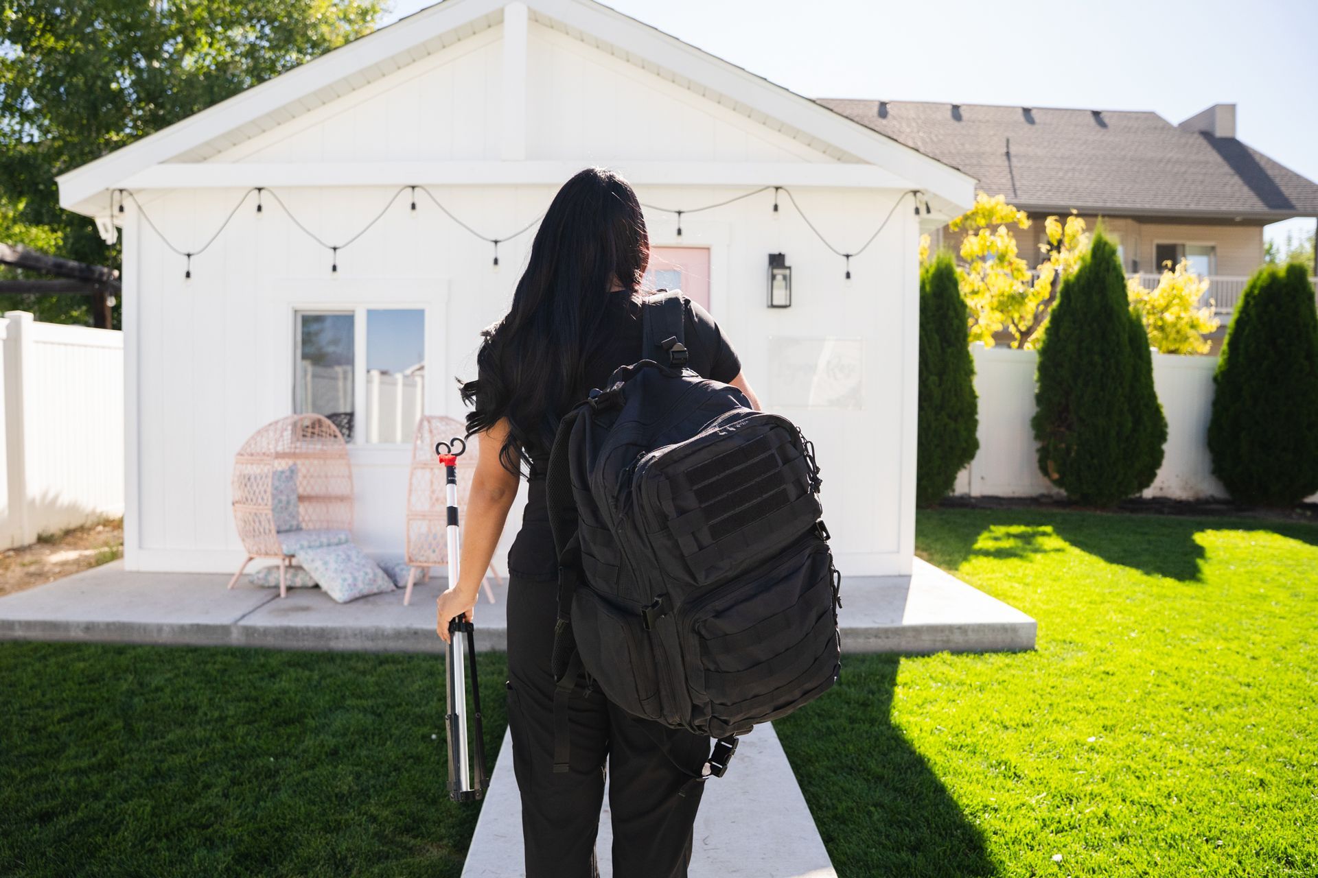 A man and a woman are sitting on a couch in a living room in front of a fireplace.