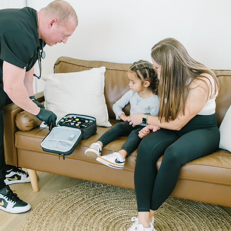 Woman on sitting on a chair getting her blood pressure checked