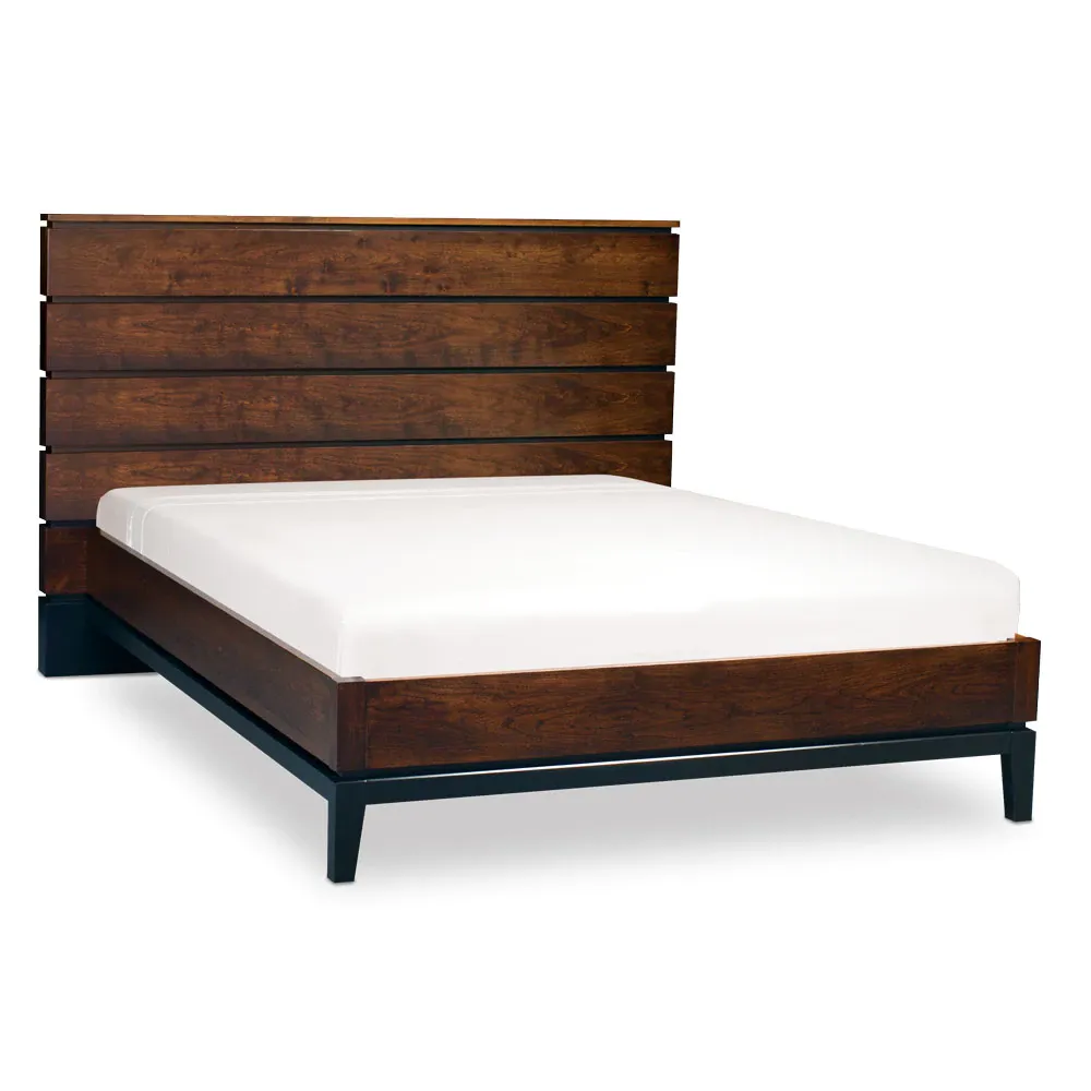 A bed with a wooden headboard and a white mattress