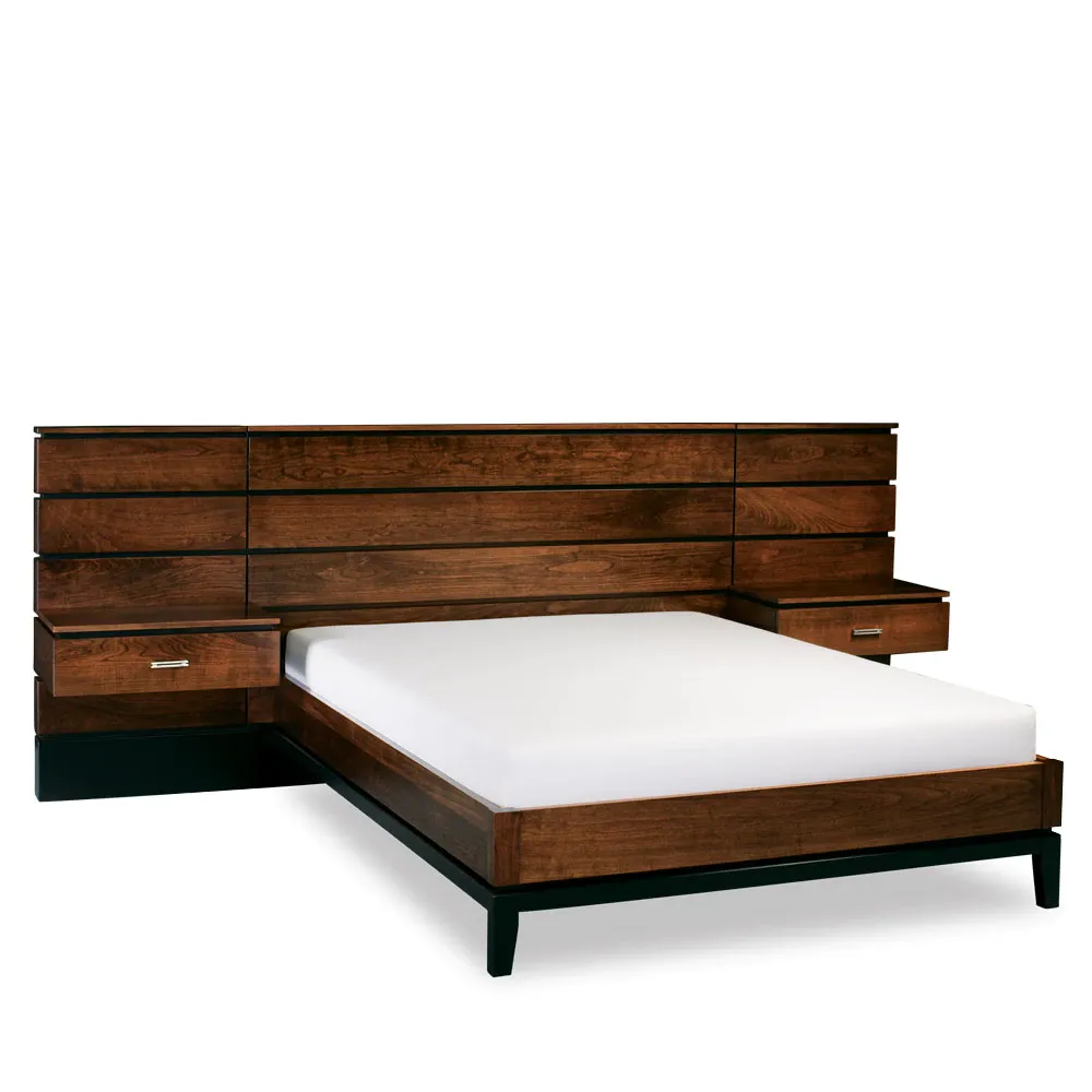 A bed with two nightstands and a wooden headboard