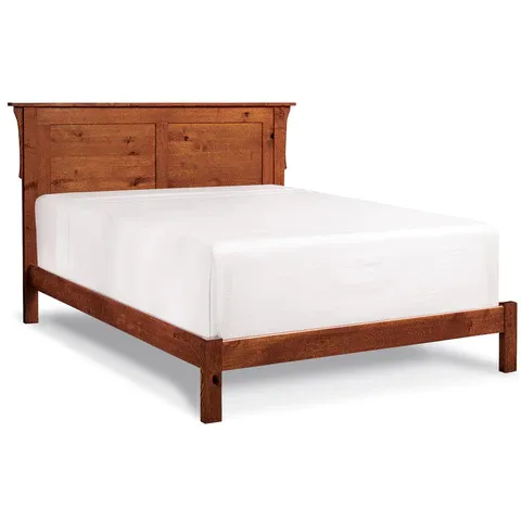 A wooden bed frame with a white mattress on it