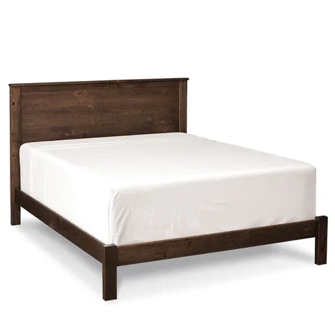 A bed with a wooden frame and white sheets on a white background.