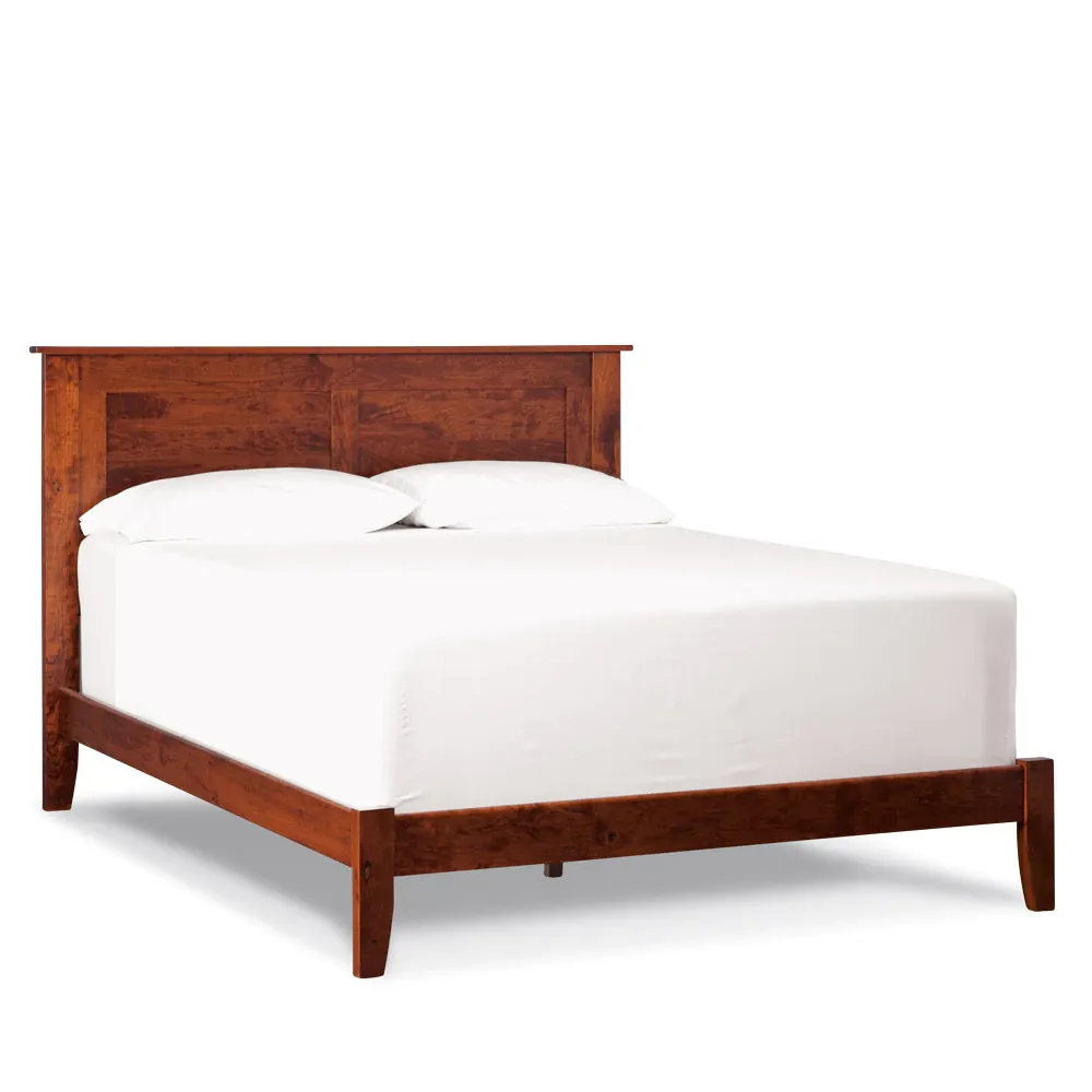 A bed with a wooden frame and white sheets