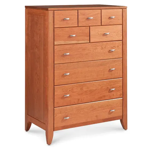 A wooden chest of drawers with seven drawers on a white background.