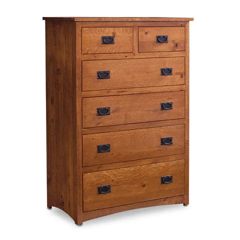 A wooden chest of drawers with black handles on a white background.