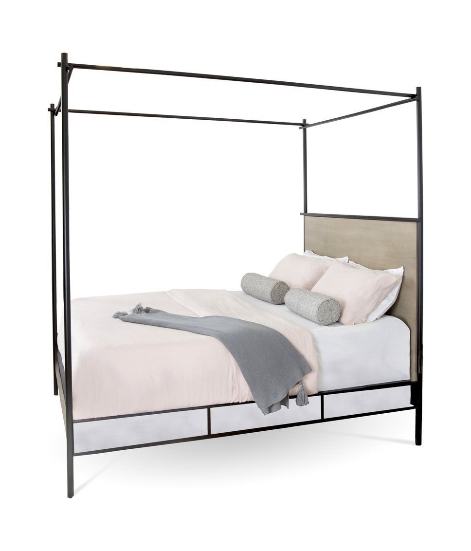 A canopy bed with white sheets and pillows on a white background