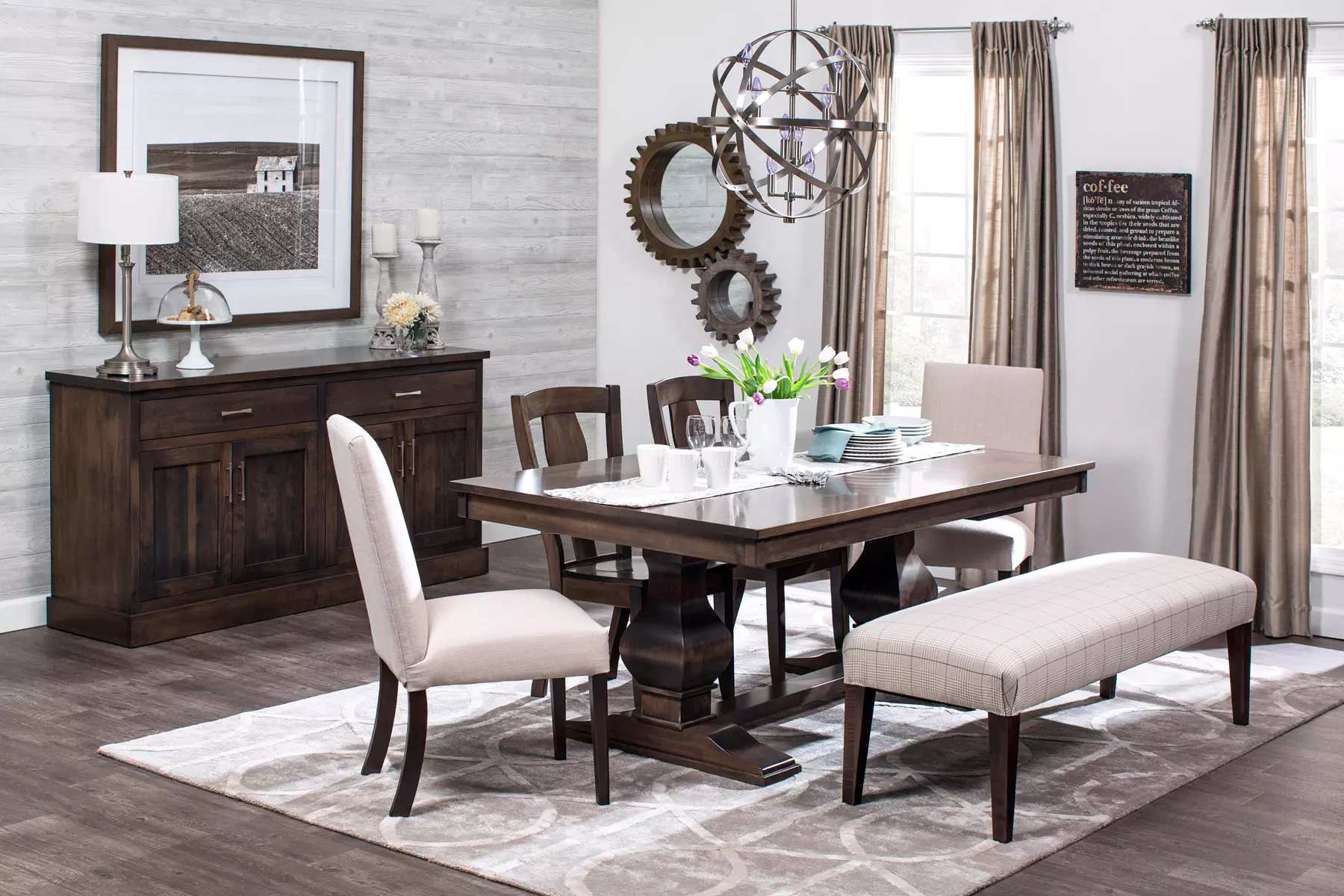 A dining room with a table , chairs , and a bench.
