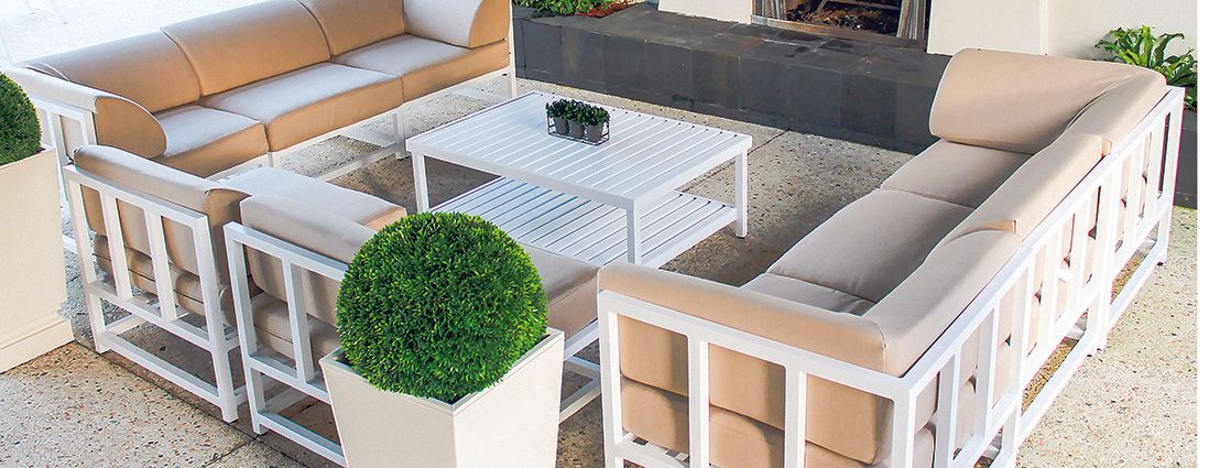 A living room with a lot of furniture and a fireplace.