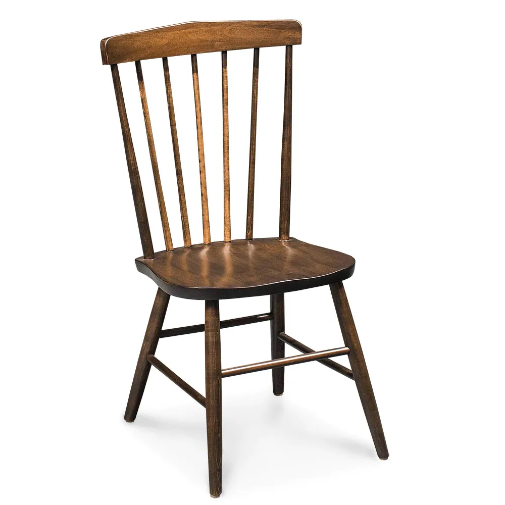 A wooden chair is sitting on a white surface.