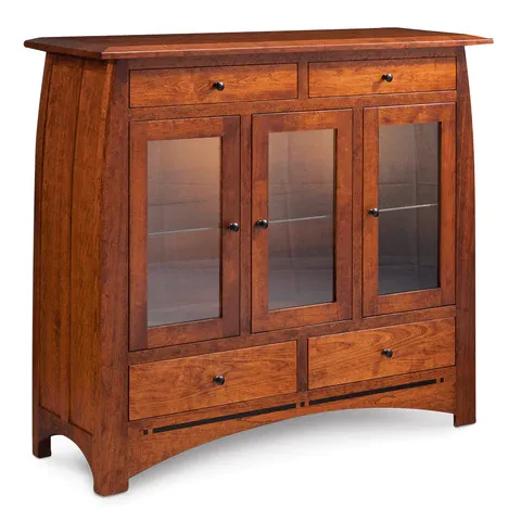 A wooden cabinet with glass doors and drawers