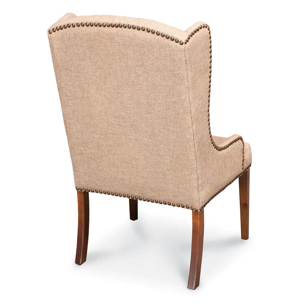 The back of a chair with studs on it