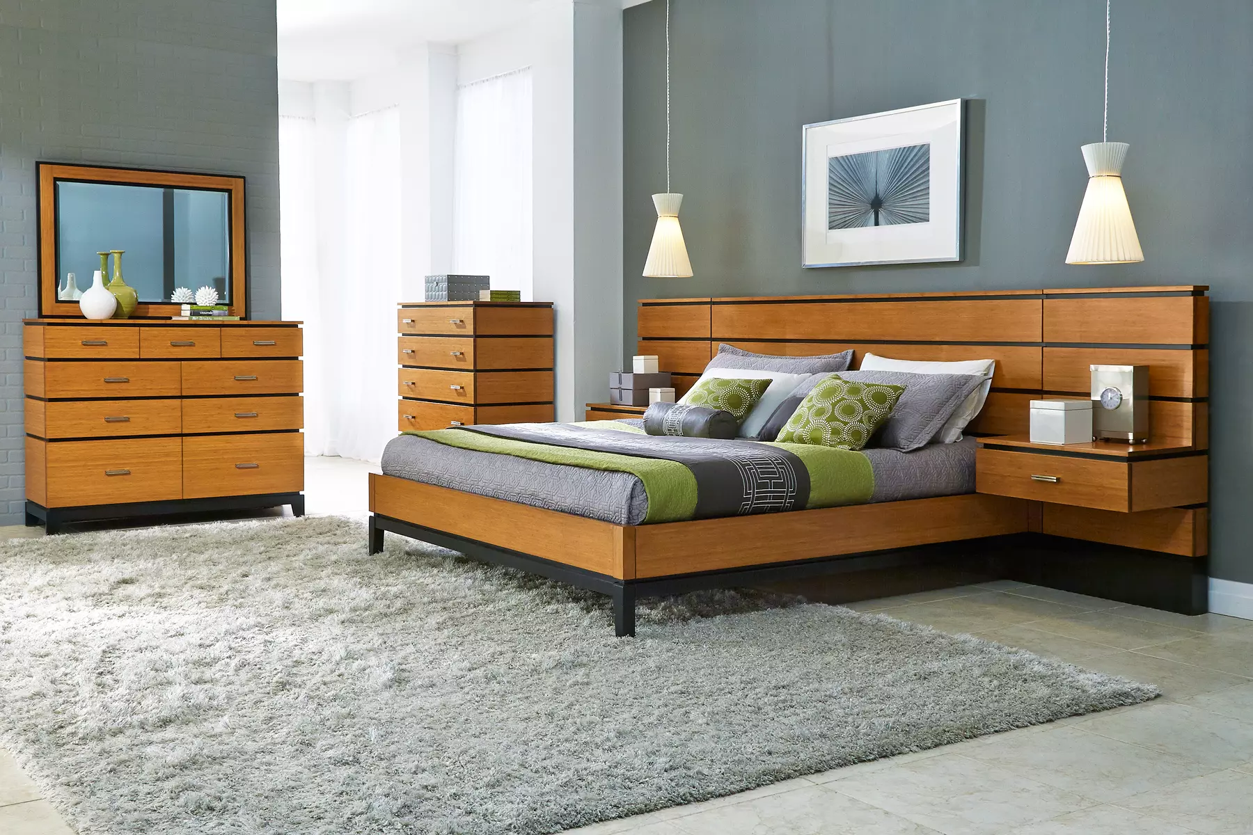 A bedroom with a bed dresser and mirror