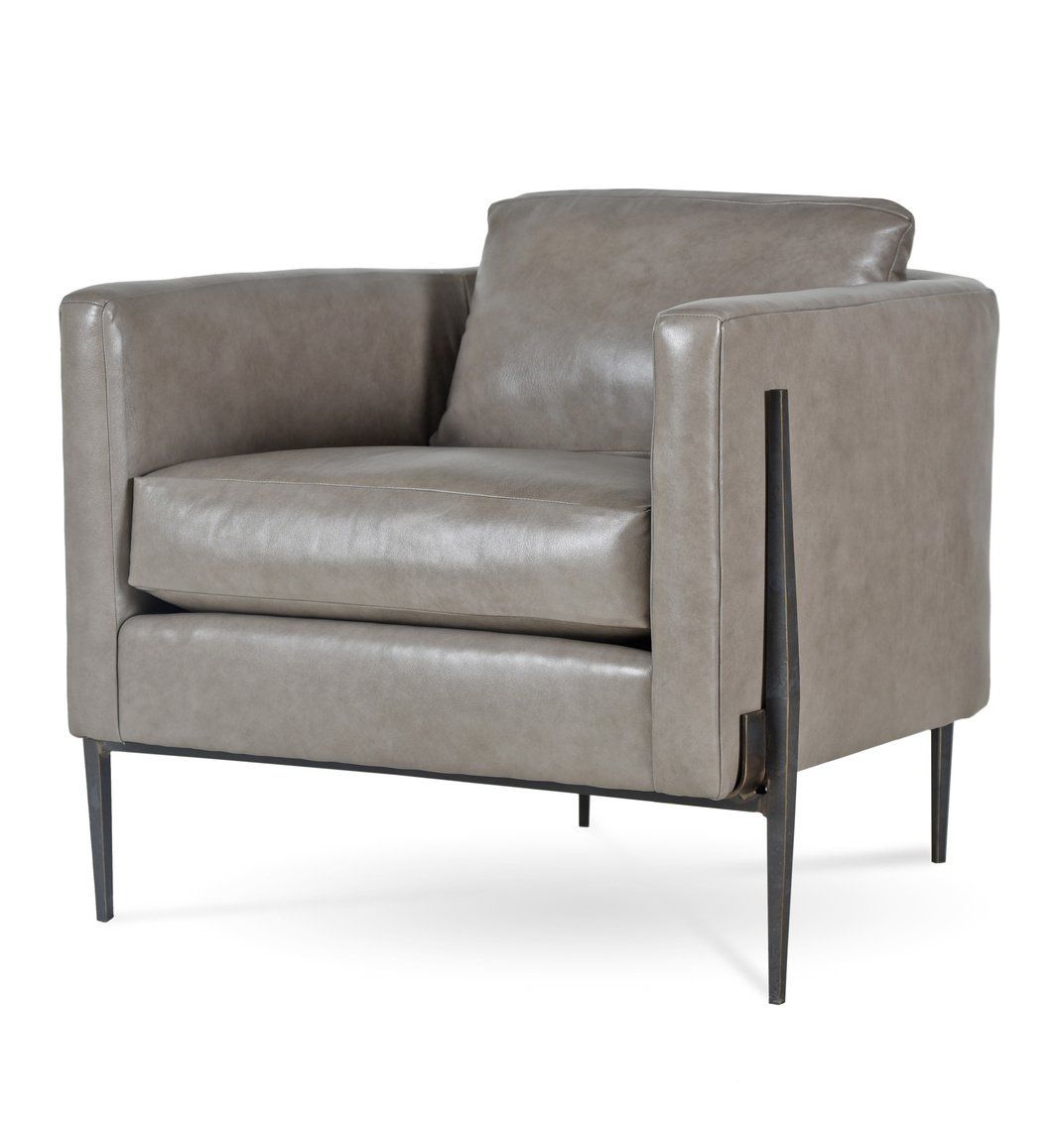 A grey leather chair with metal legs on a white background