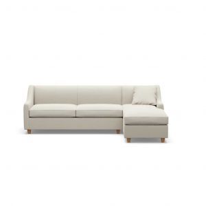 A white sectional couch with a chaise lounge on a white background.