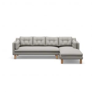 A grey sectional couch with wooden legs on a white background.