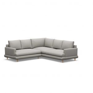 A grey sectional couch with wooden legs on a white background.