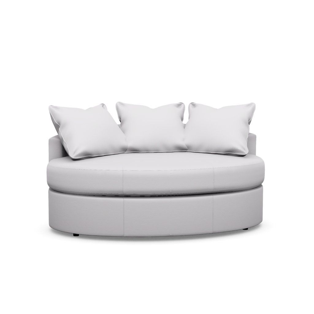 A round couch with three pillows on a white background.