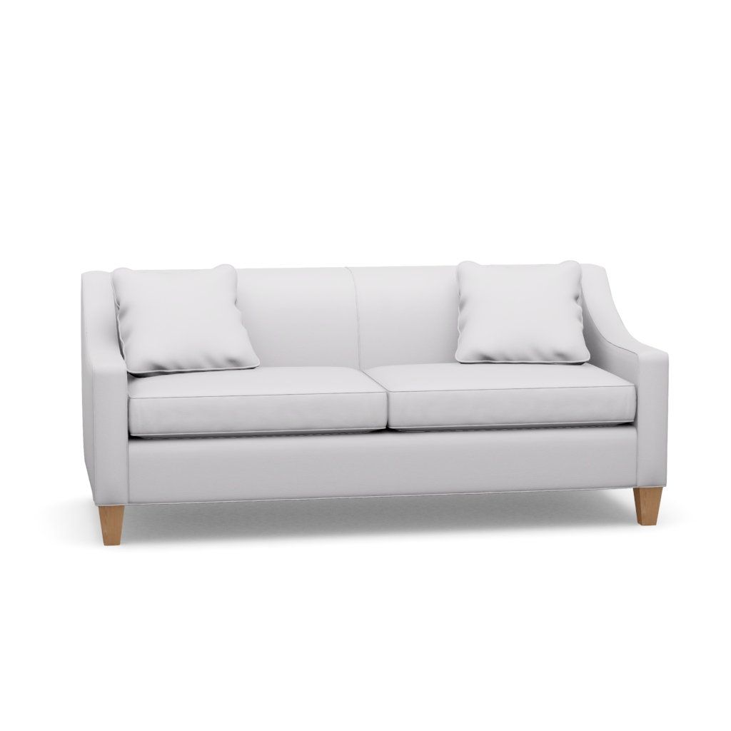 A white couch with two pillows on a white background.