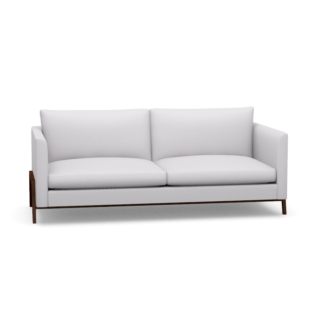 A white couch with wooden legs on a white background.