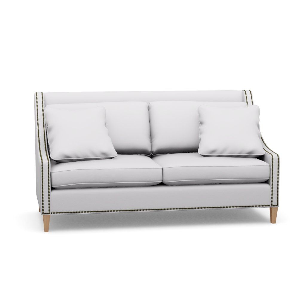 A white couch with two pillows on a white background.