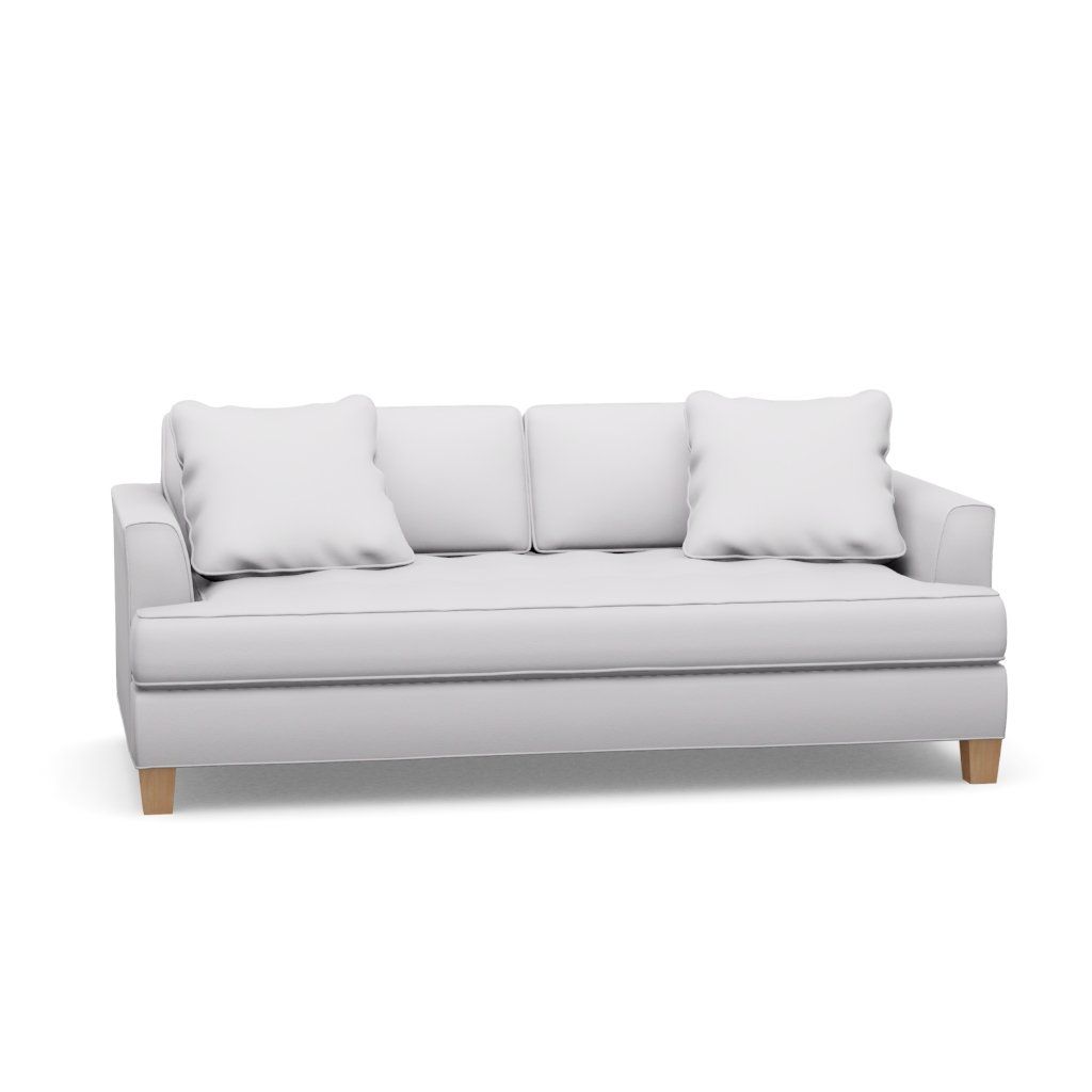 A white couch with wooden legs and pillows on a white background.