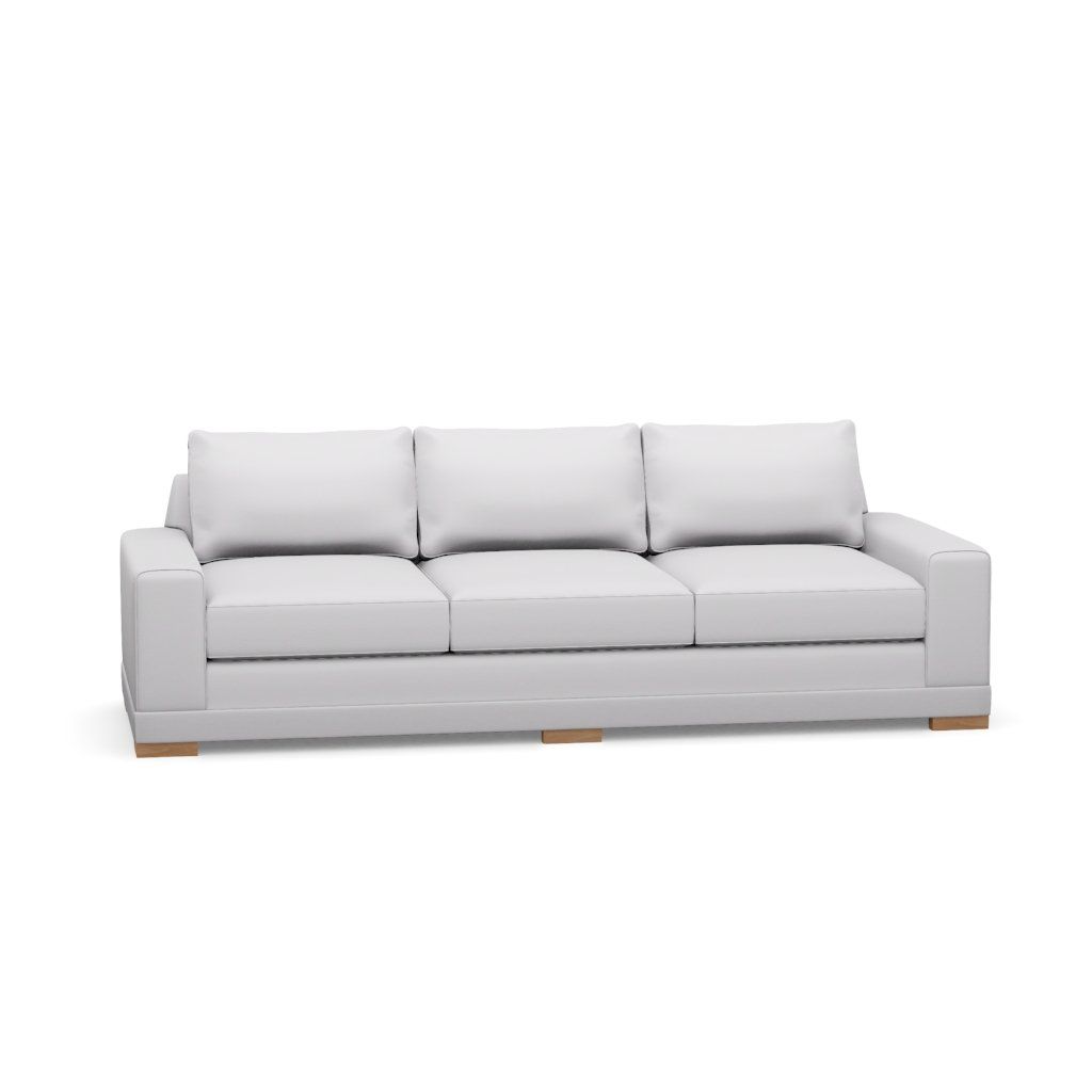 A white couch with wooden legs on a white background.