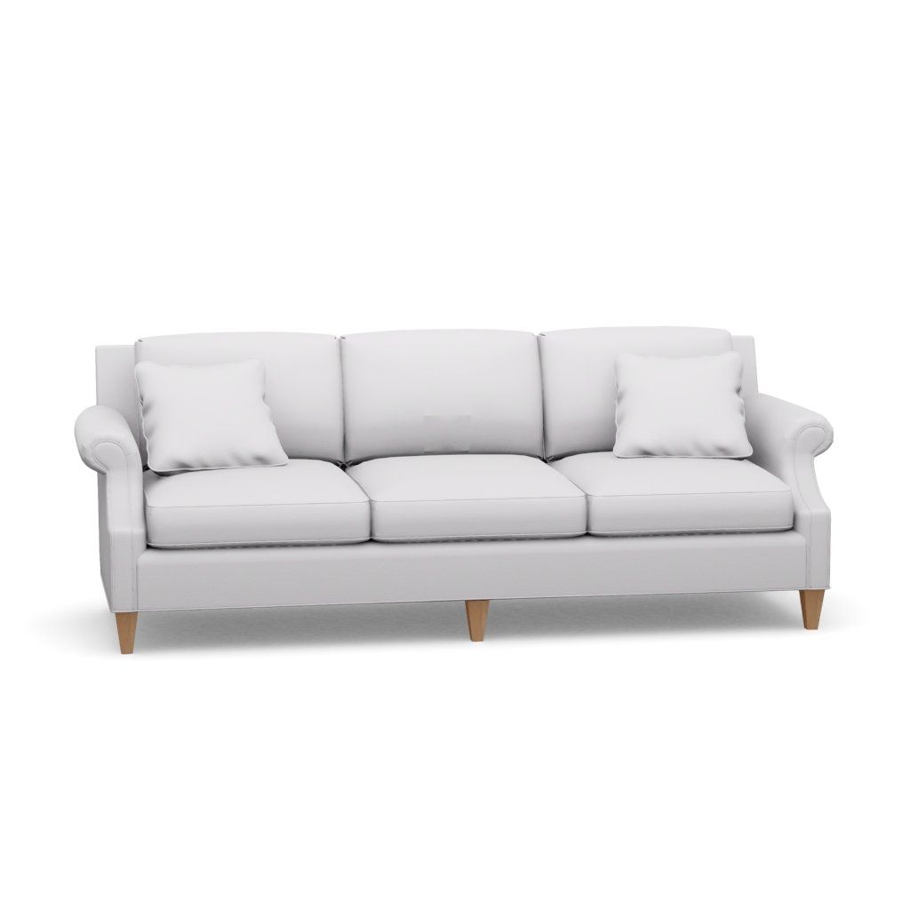 A white couch with pillows on it on a white background.