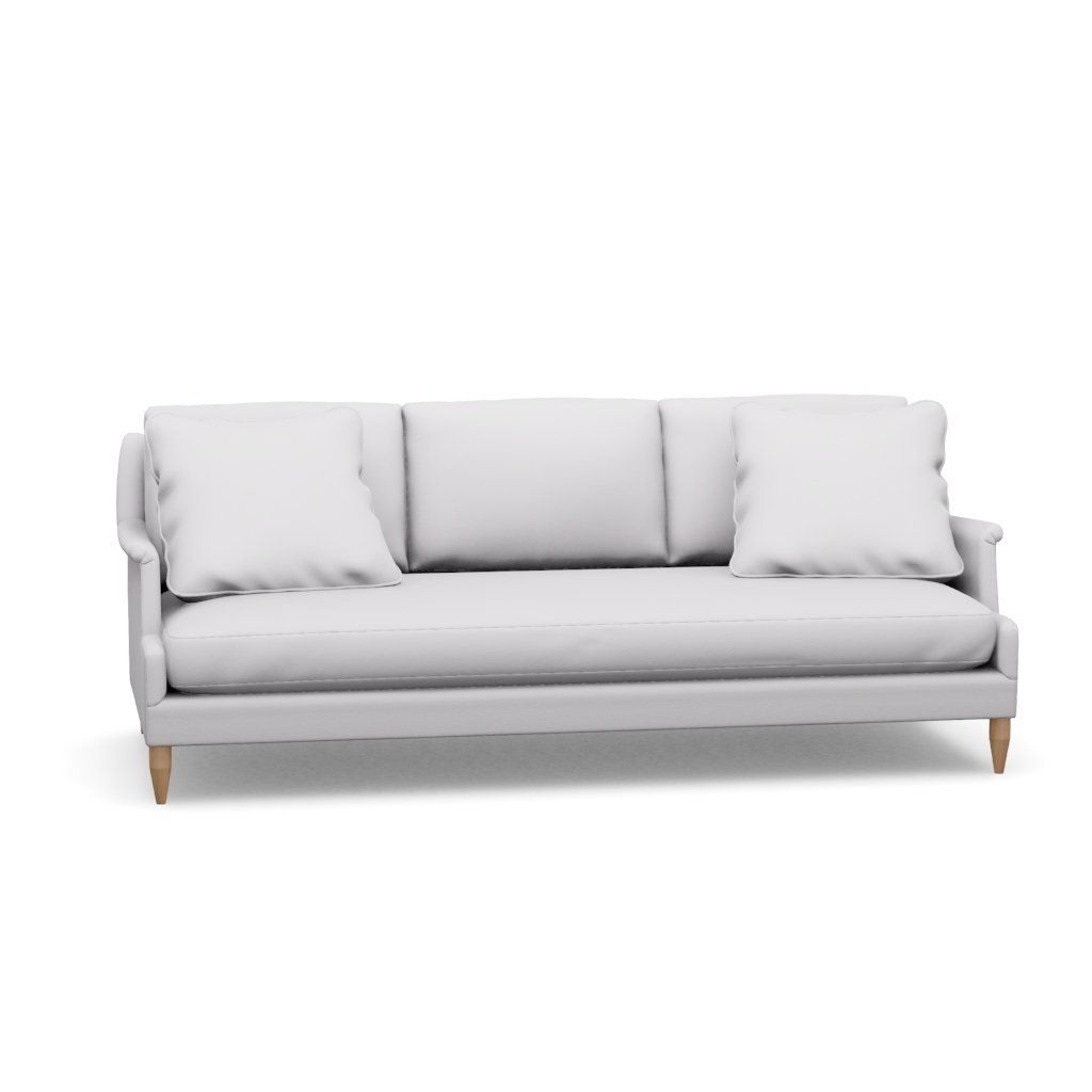 A white couch with three pillows on a white background.